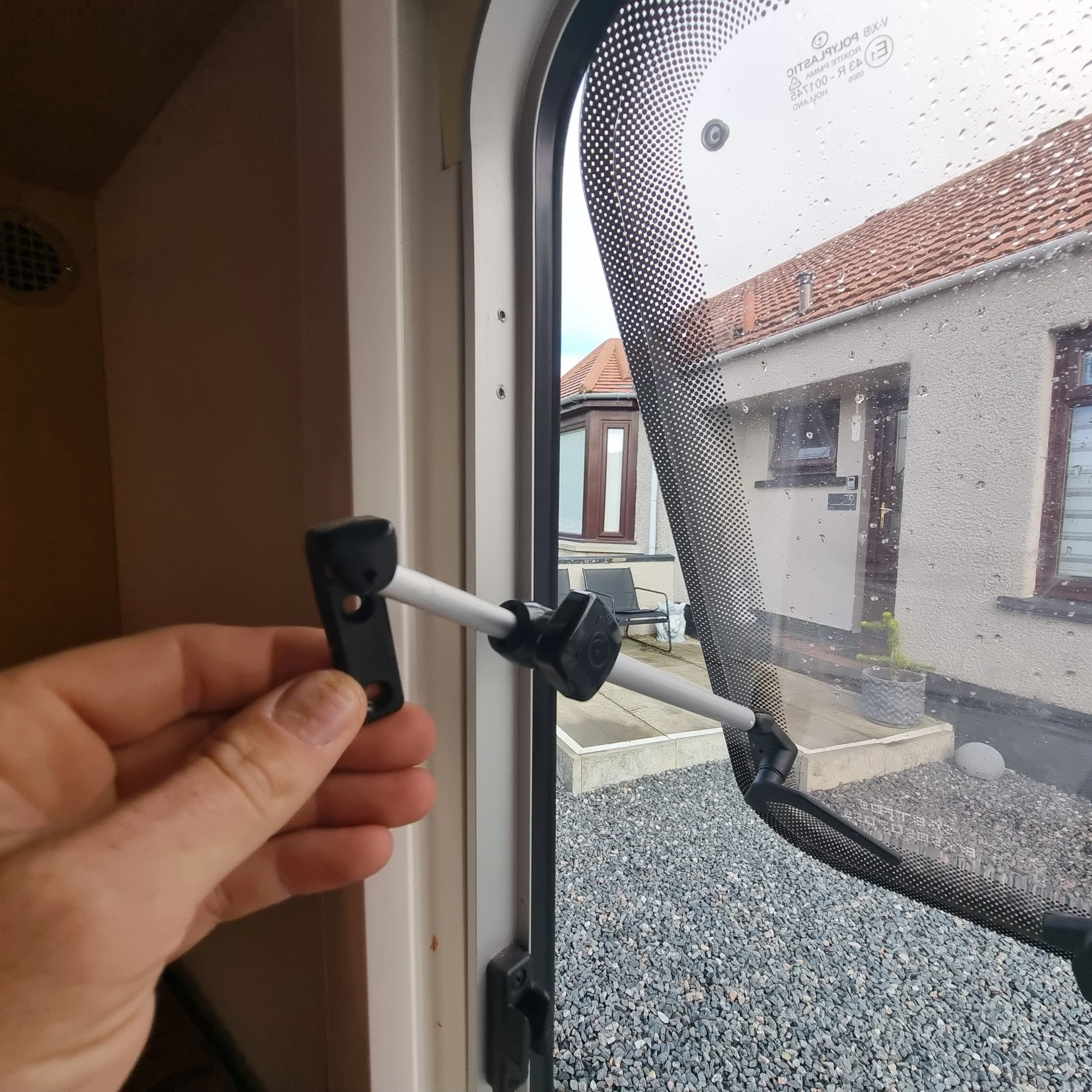 Removing damaged window stays and latches on the Bailey caravan