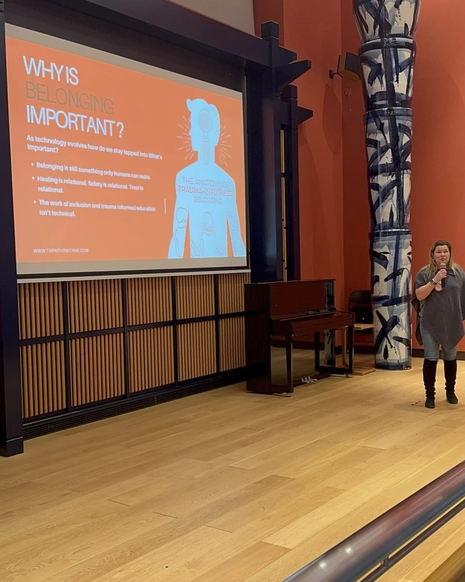 Janice Stewart-Yates presenting beside a slide on why belonging is important
