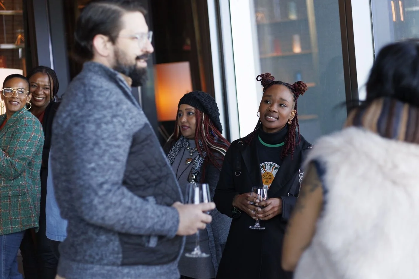 Guests in lively conversation at a Talks on Tap and REM evening