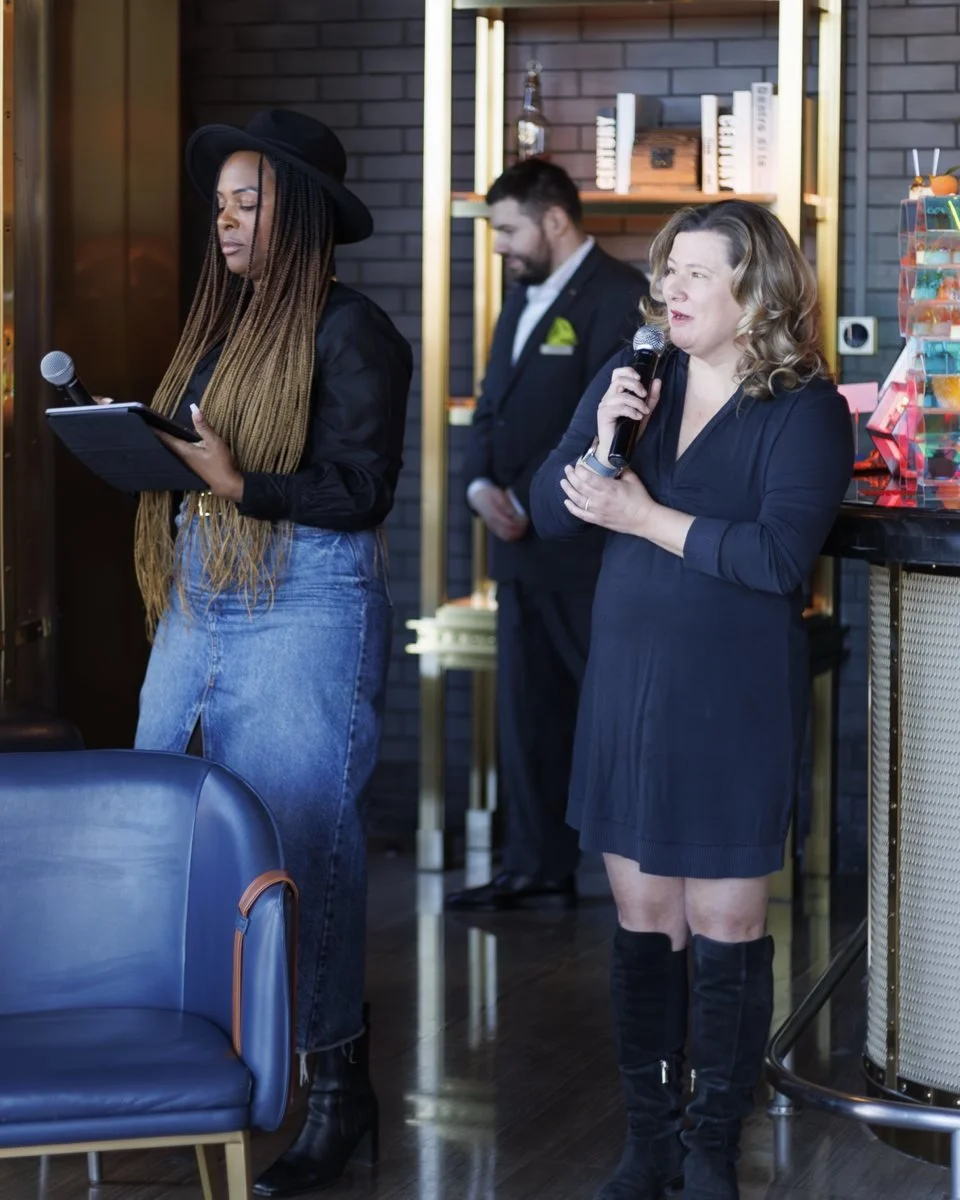 Nicole Bonnah and Janice Stewart-Yates co-hosting REM Beijing, microphones in hand