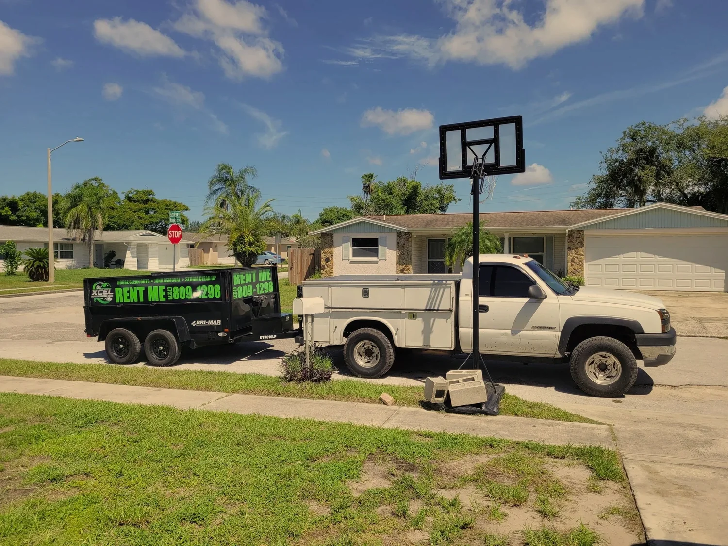 Truck towing Xcel dump trailer
