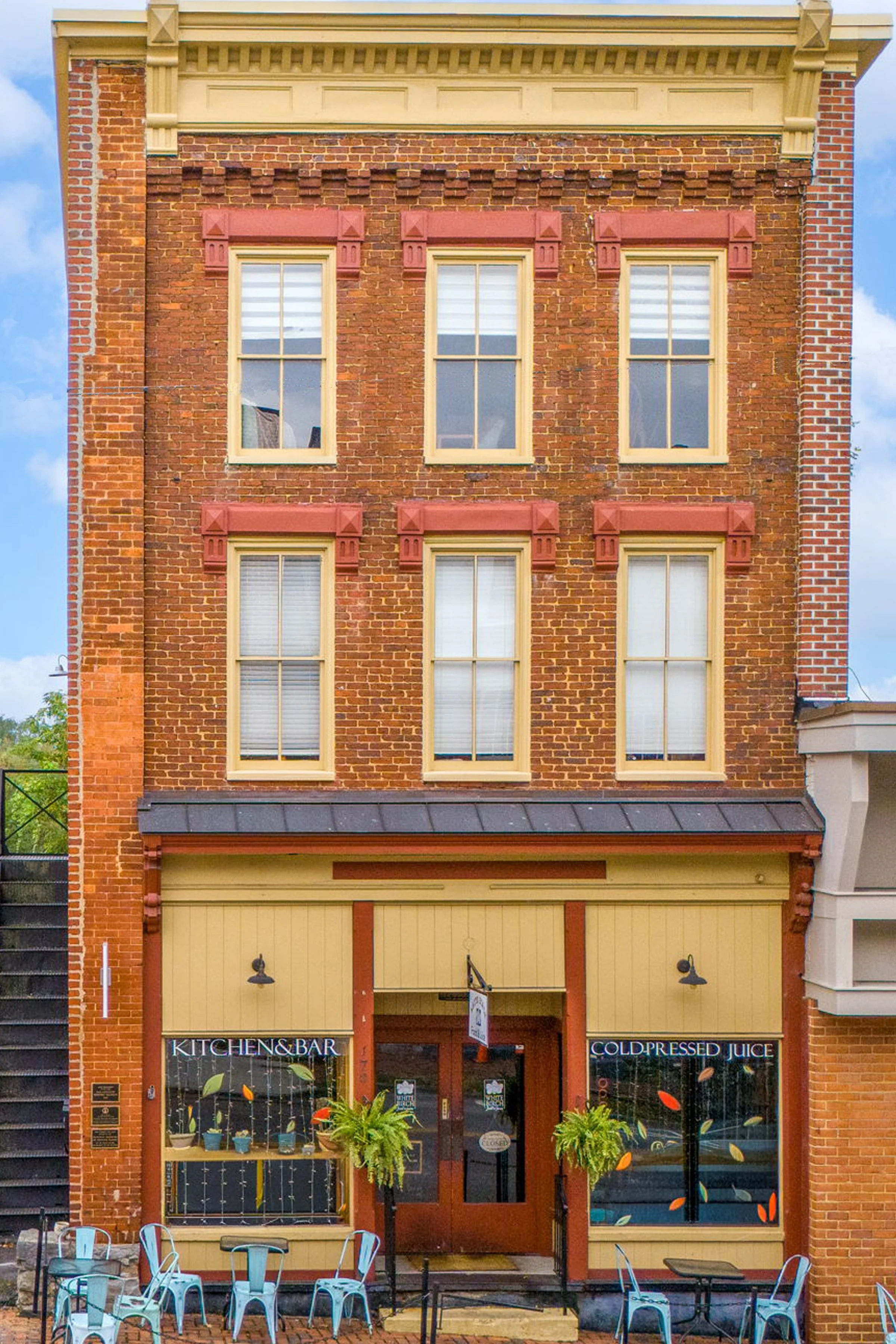The three-story brick front of Moore on Main on Main Street