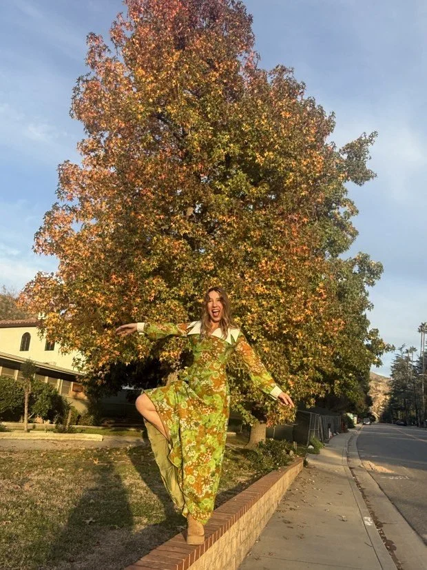 Catherine balancing beneath an autumn tree in Altadena