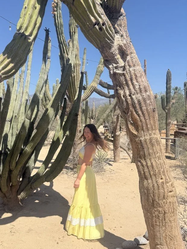 Catherine of Hi Heart Healing dancing among cacti