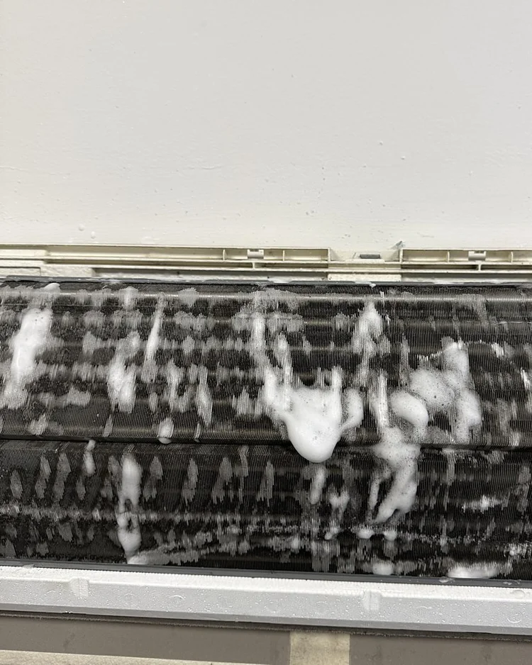 Ductless unit coil covered in cleaning foam