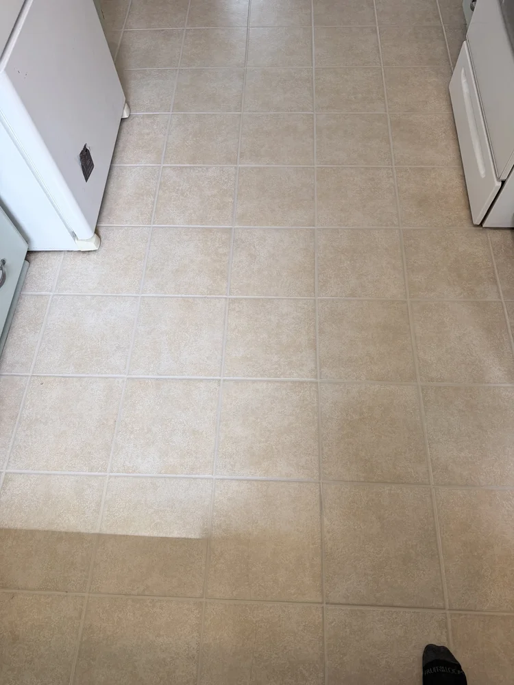Same beige kitchen tile floor after cleaning and lighter grout colorsealing