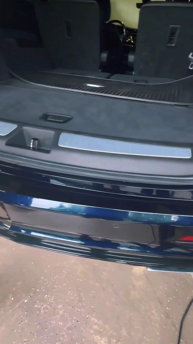 Refined dark rear loading edge after correction, shown only as preparation context before a ceramic coating decision