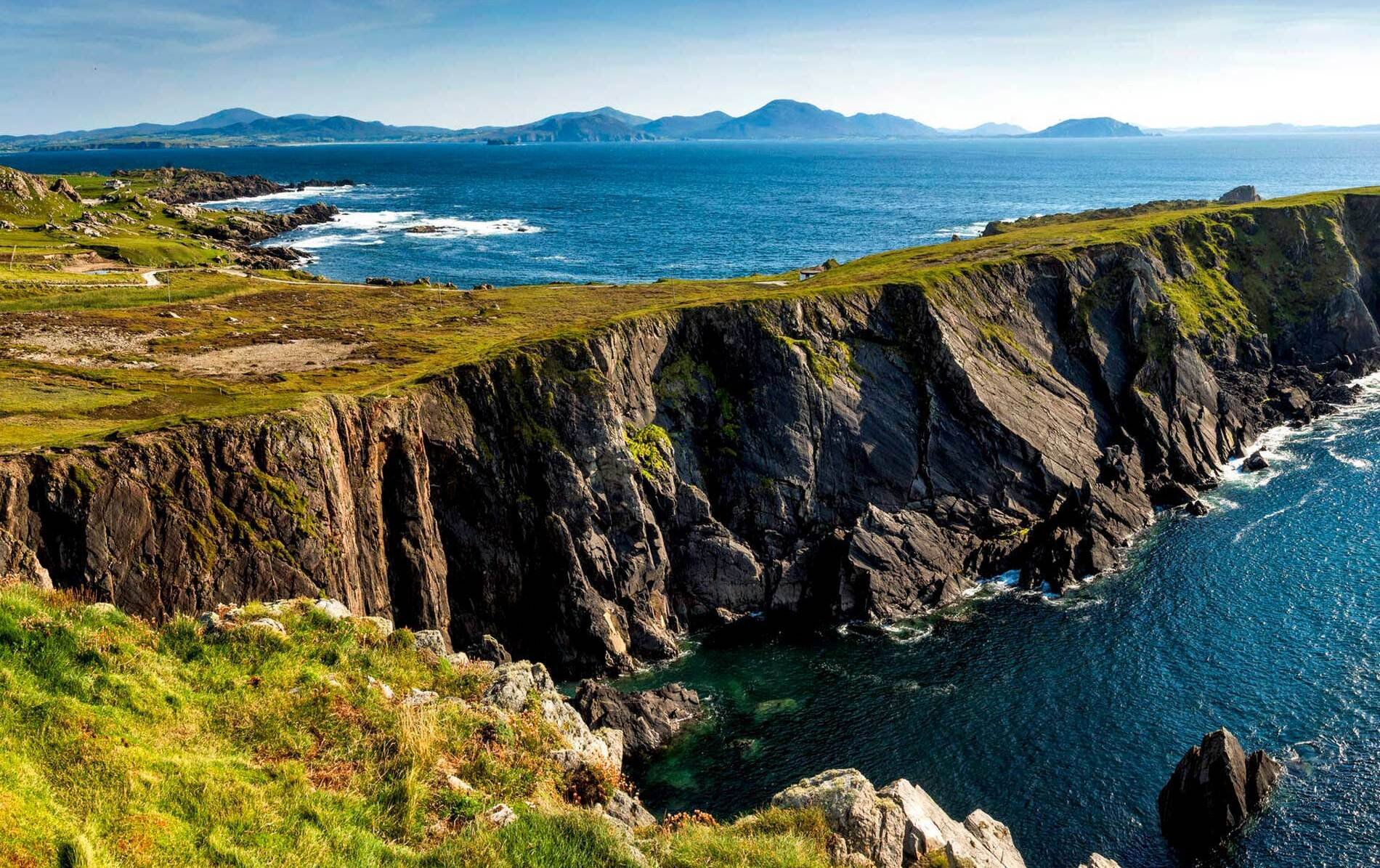 Dramatic green Irish coastal cliffs above the Atlantic Ocean