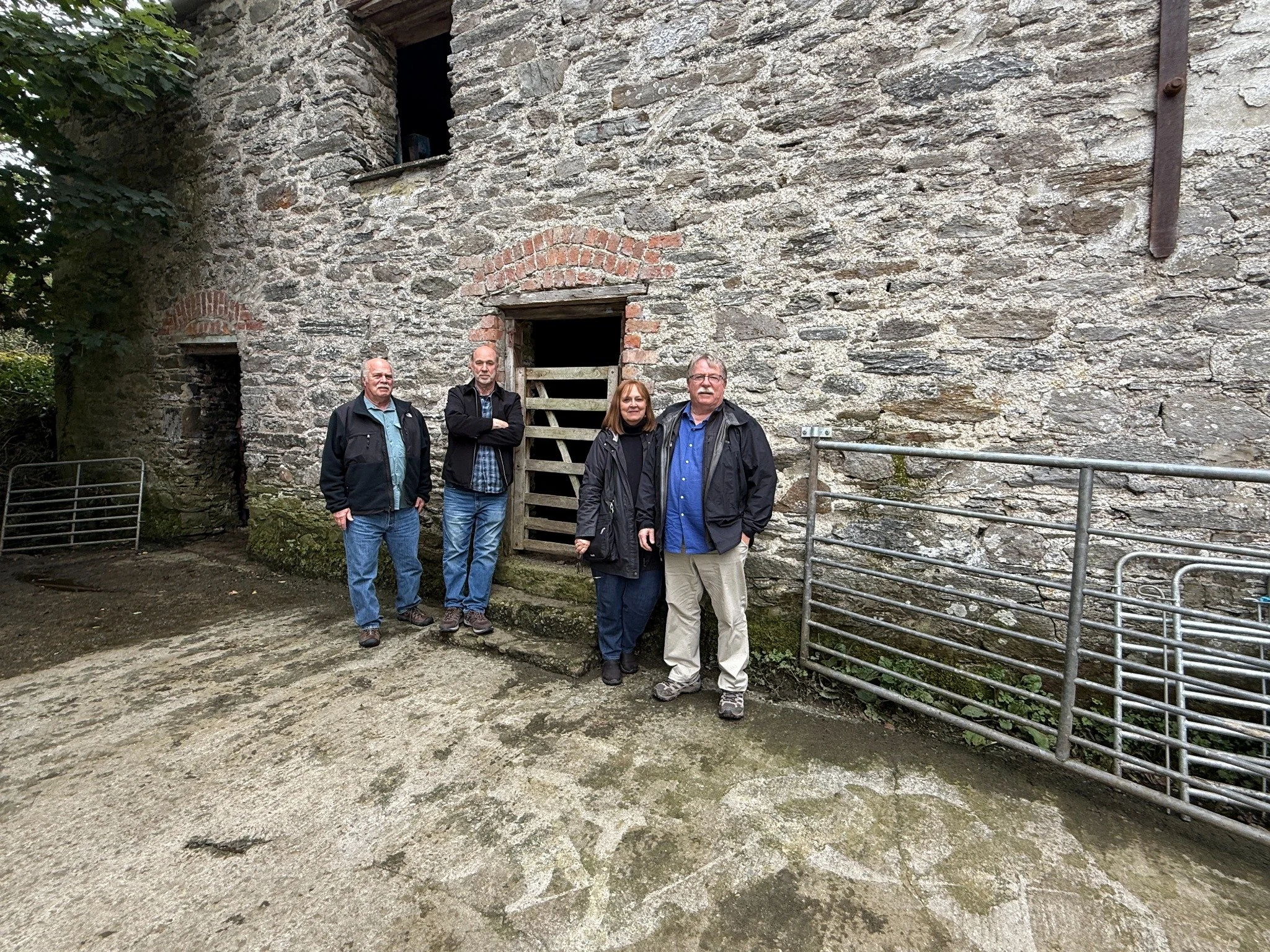 Tracey Saucey’s group beside a historic stone building