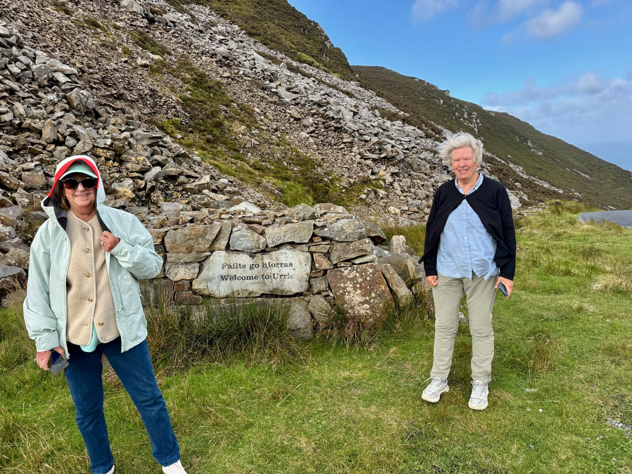Debi and Denise beside the Welcome to Urris stone