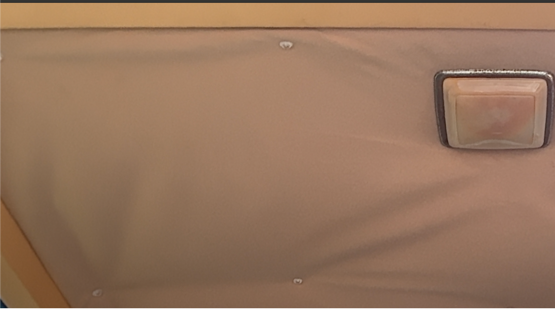 Finished headliner repair using twist pins in a 1985 Chrysler Town and Country wagon