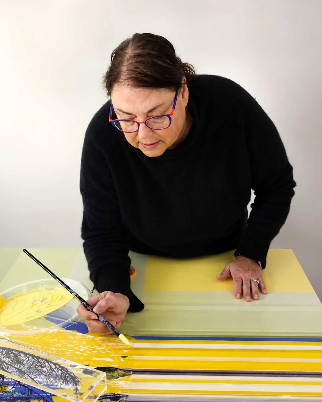 Karen Olsen-Dunn painting in her studio