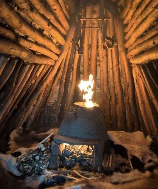 Fire inside a timber kåta