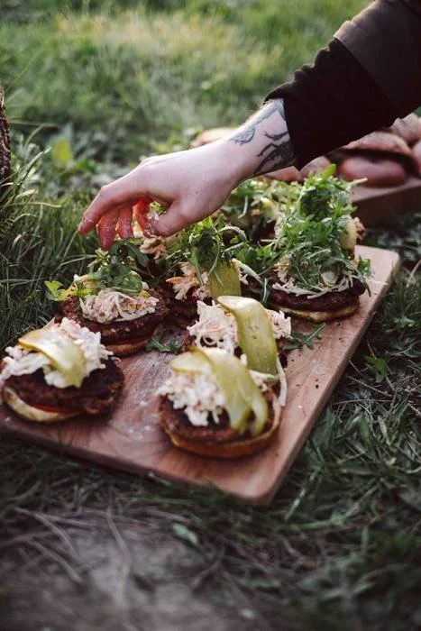 Open sandwiches with wild greens on a board