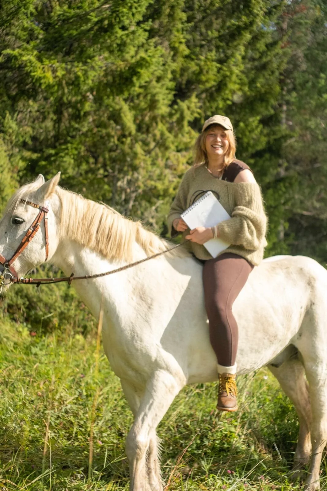 Riding a white horse in the forest