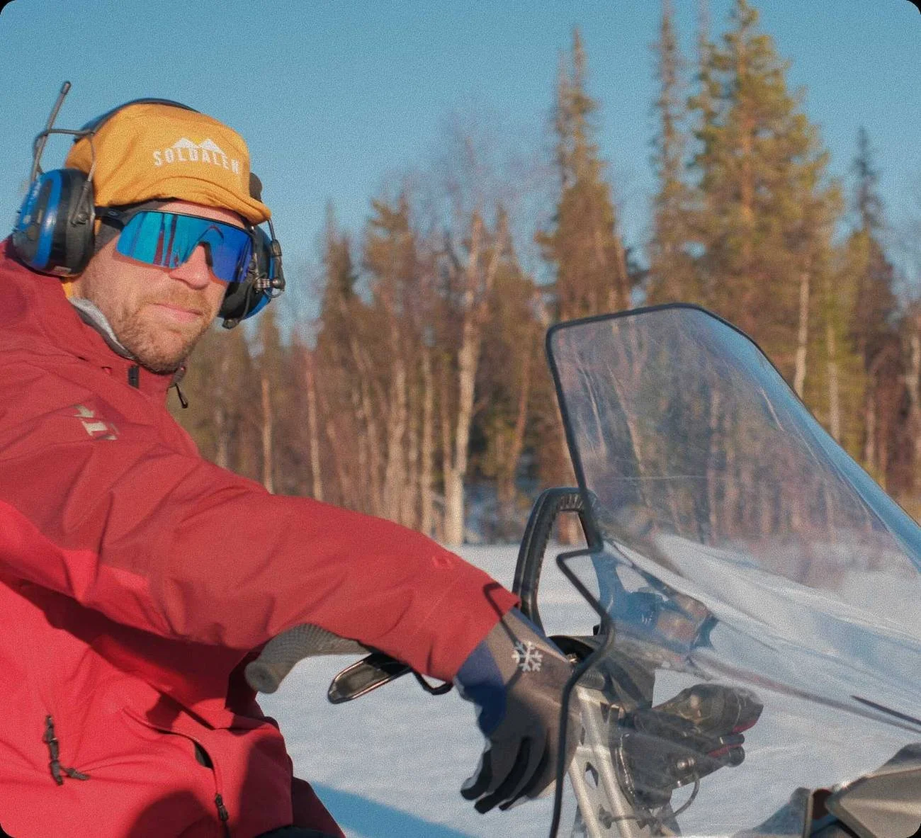 Roger on his snowmobile in the forest