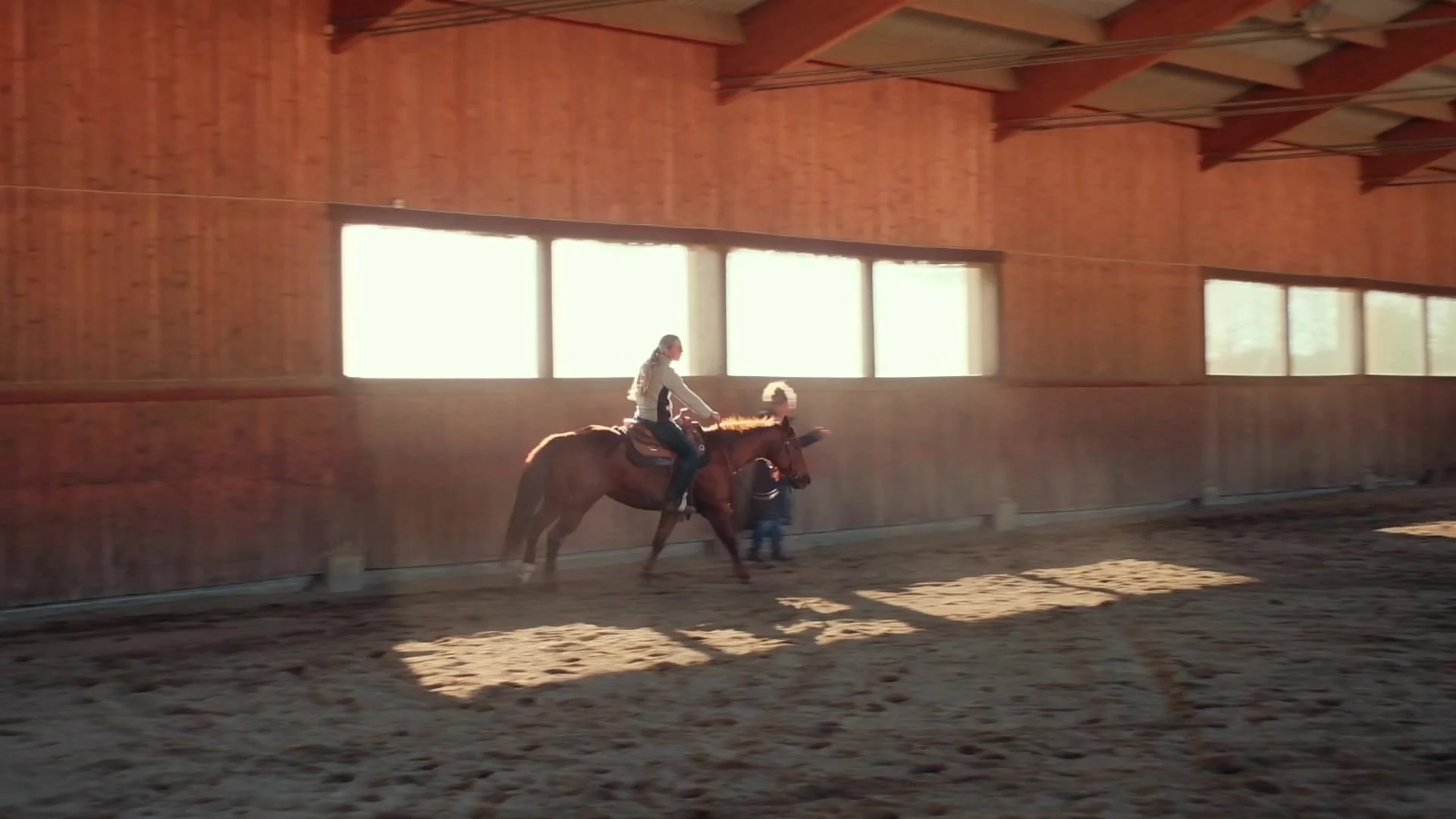 Riding in the arena with light coming through the windows