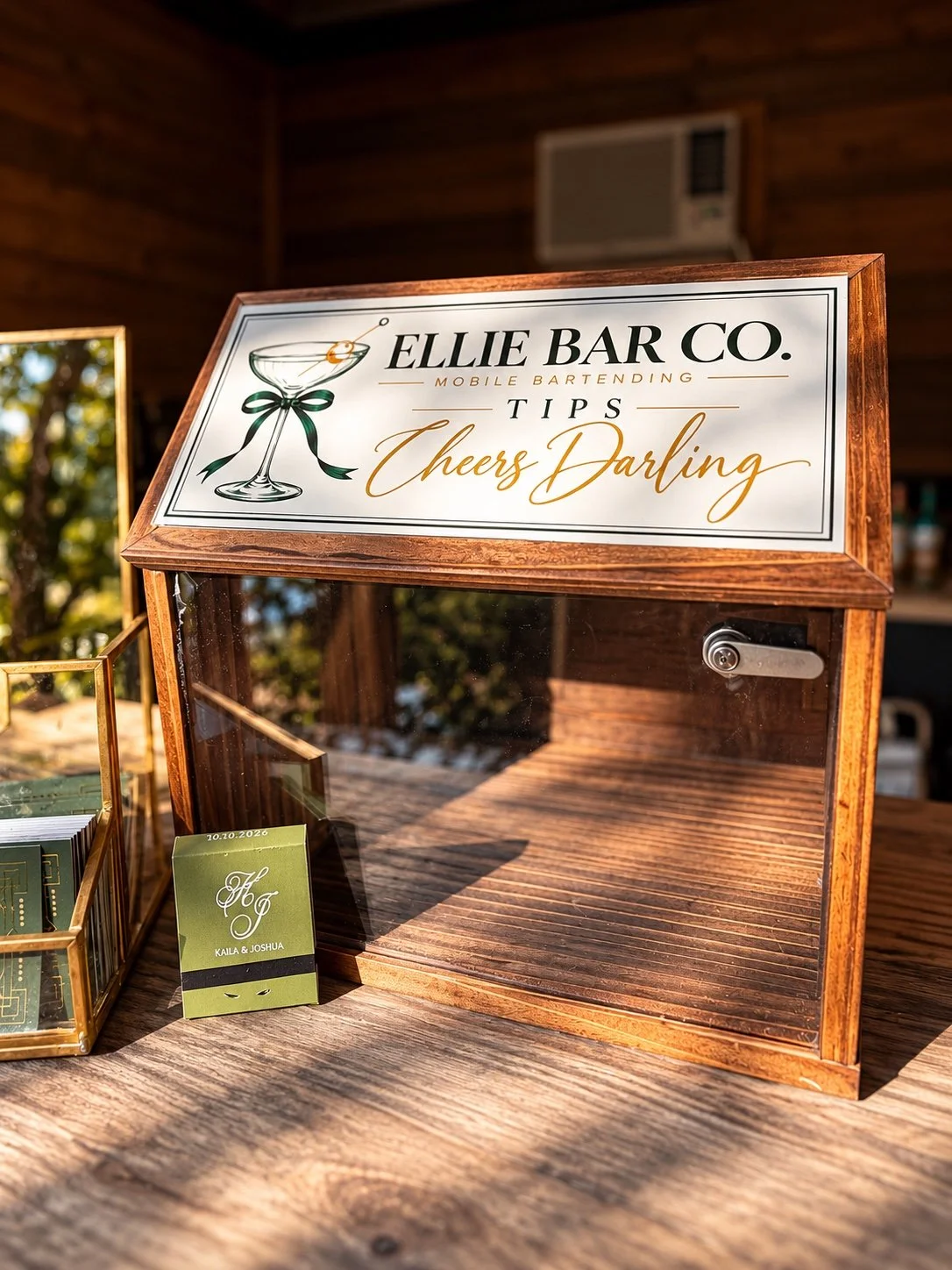 Ellie Bar Co. branded wooden tip box displayed on a rustic wedding bar