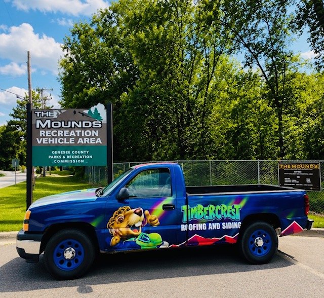 Timbercrest mascot on branded apparel and signage