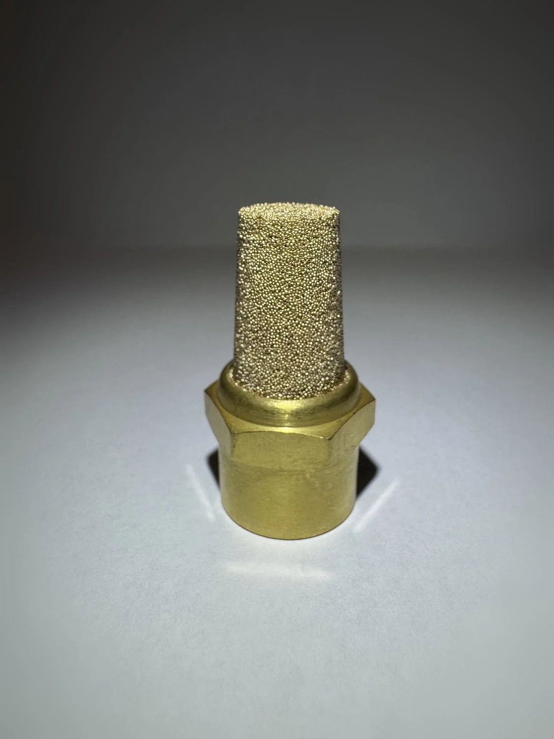 The Perfect Purge argon back-purge device: sintered bronze element on a hex brass body.