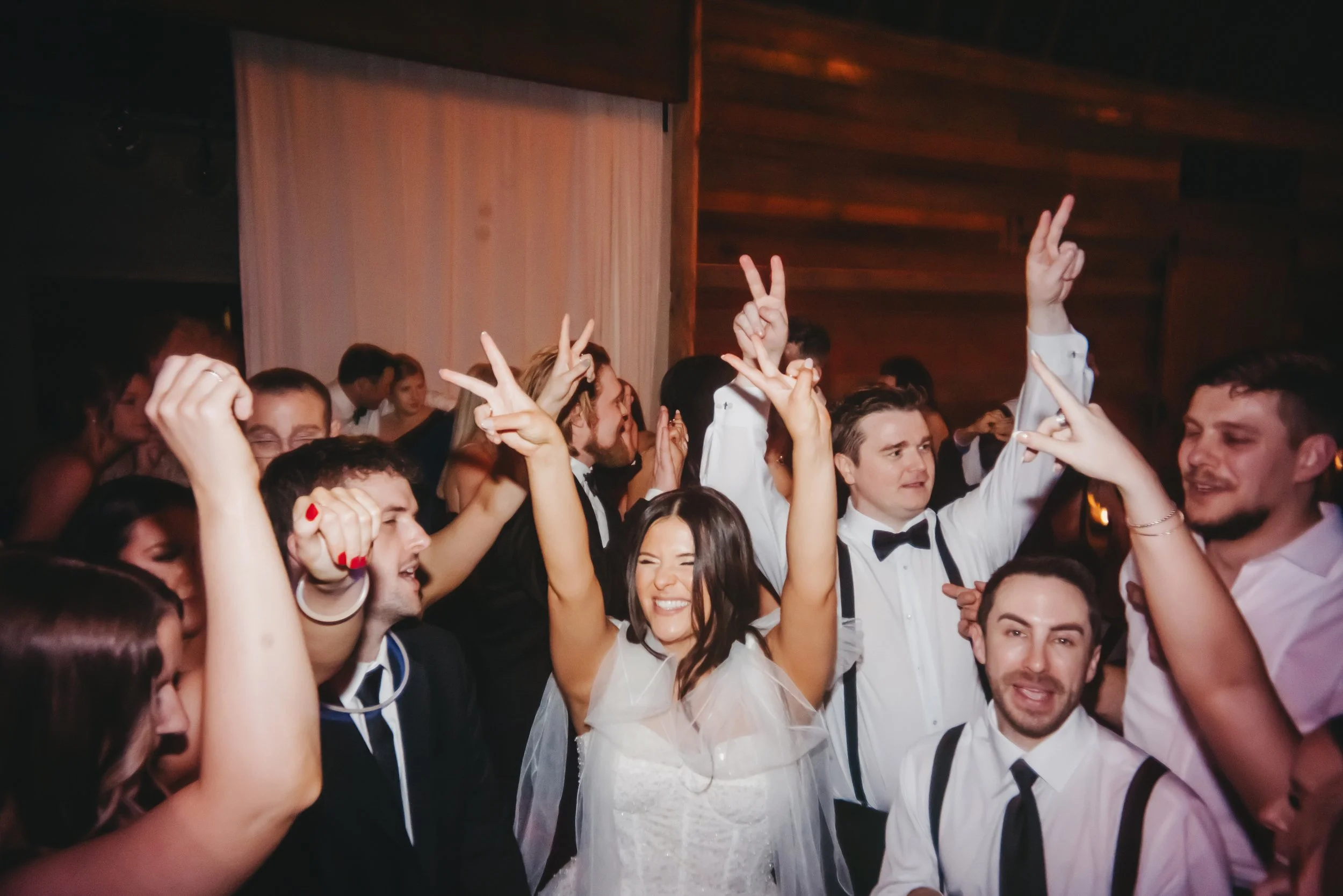 Wedding guests dancing together