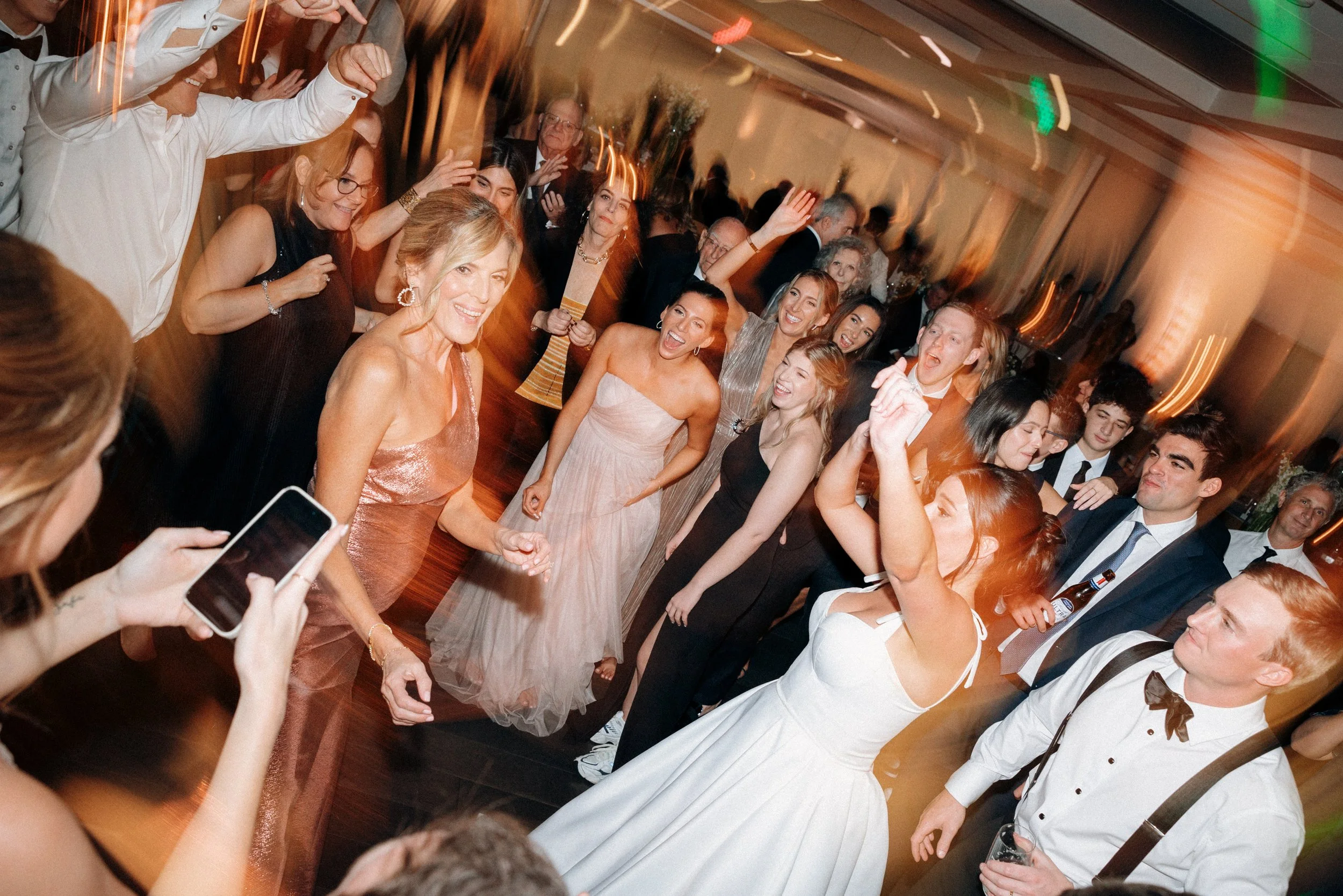 Wedding guests dancing together