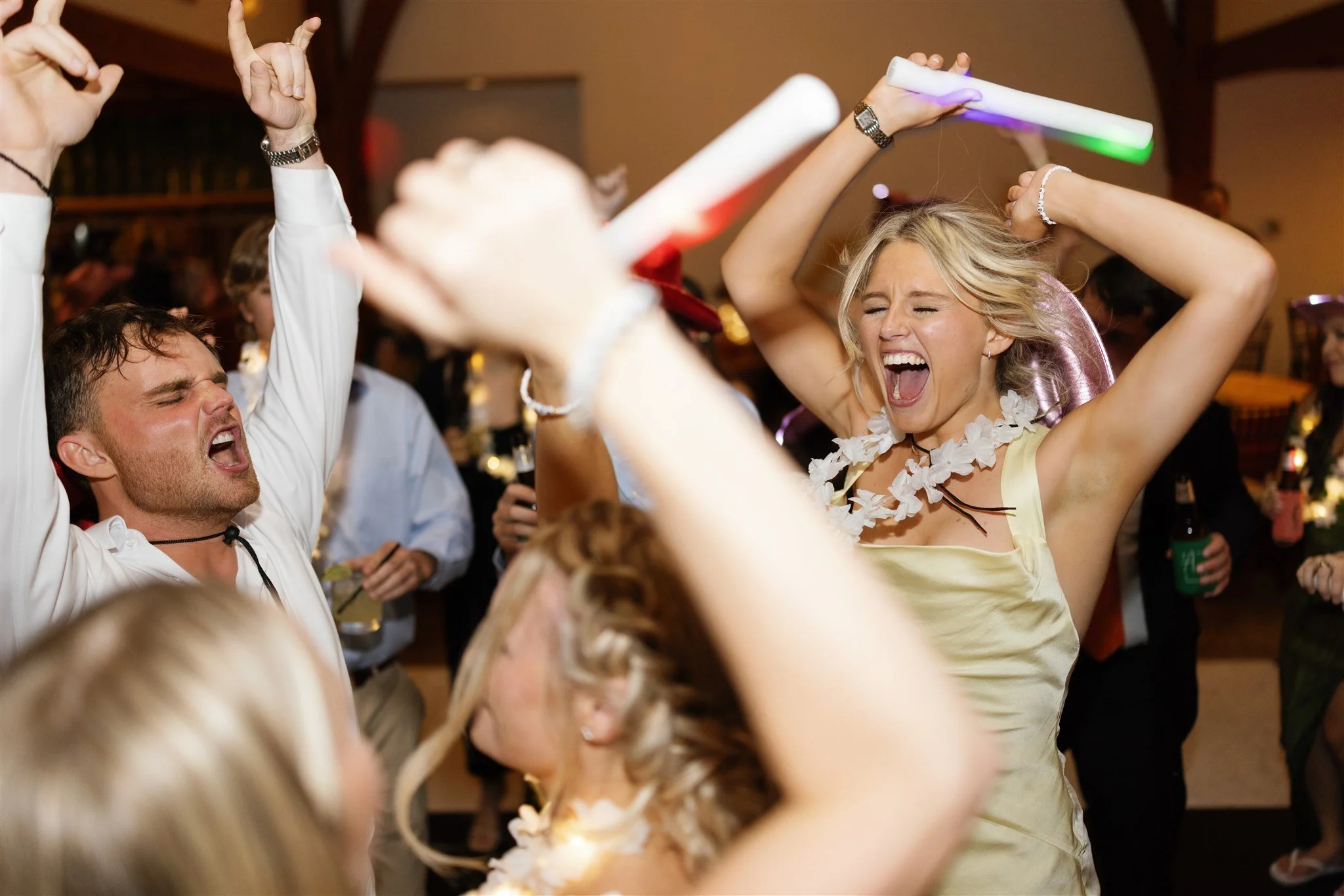 Wedding guests celebrating on the dance floor