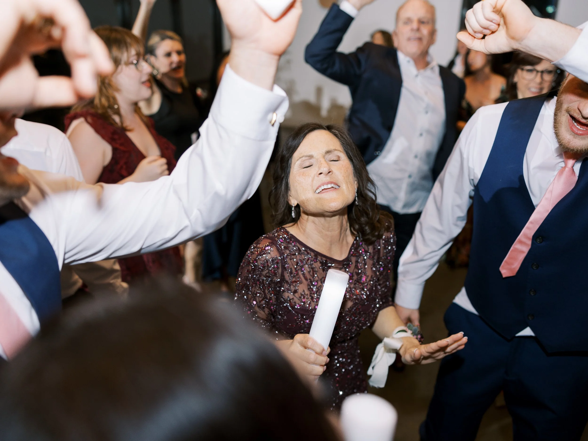 Wedding guests celebrating on the dance floor