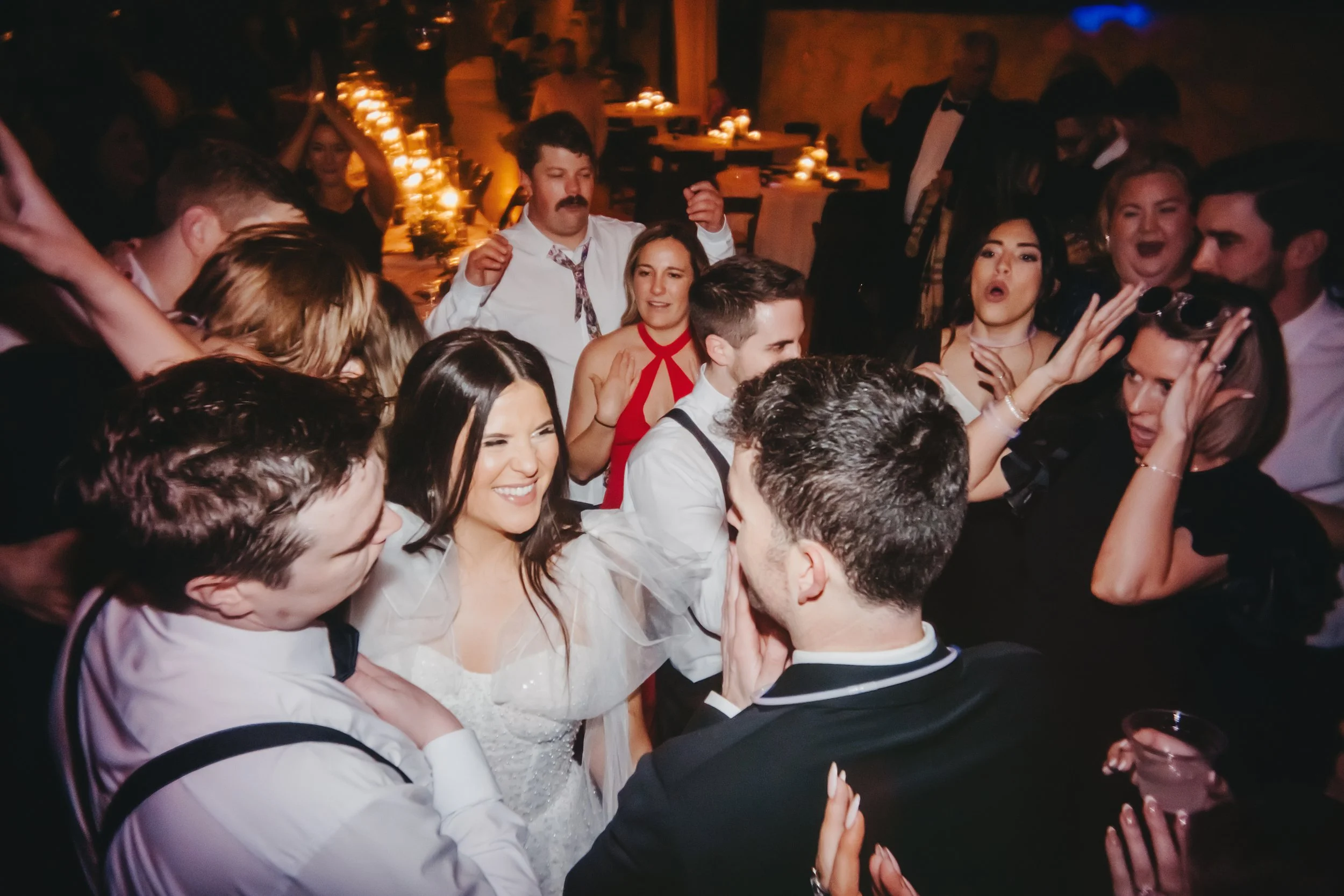 Wedding guests celebrating on the dance floor