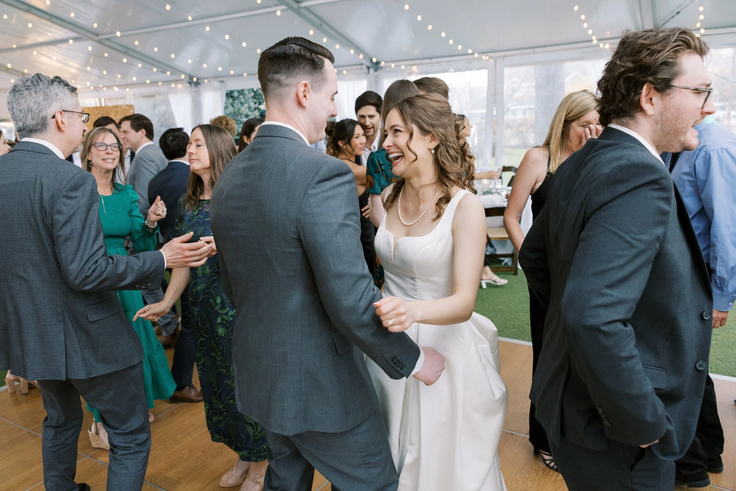 Wedding guests dancing together
