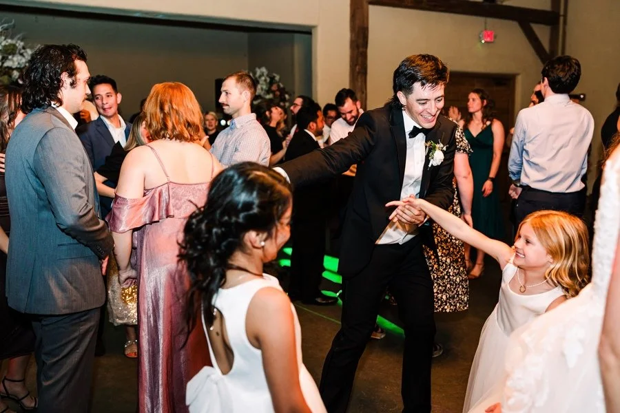 Wedding guests celebrating on the dance floor