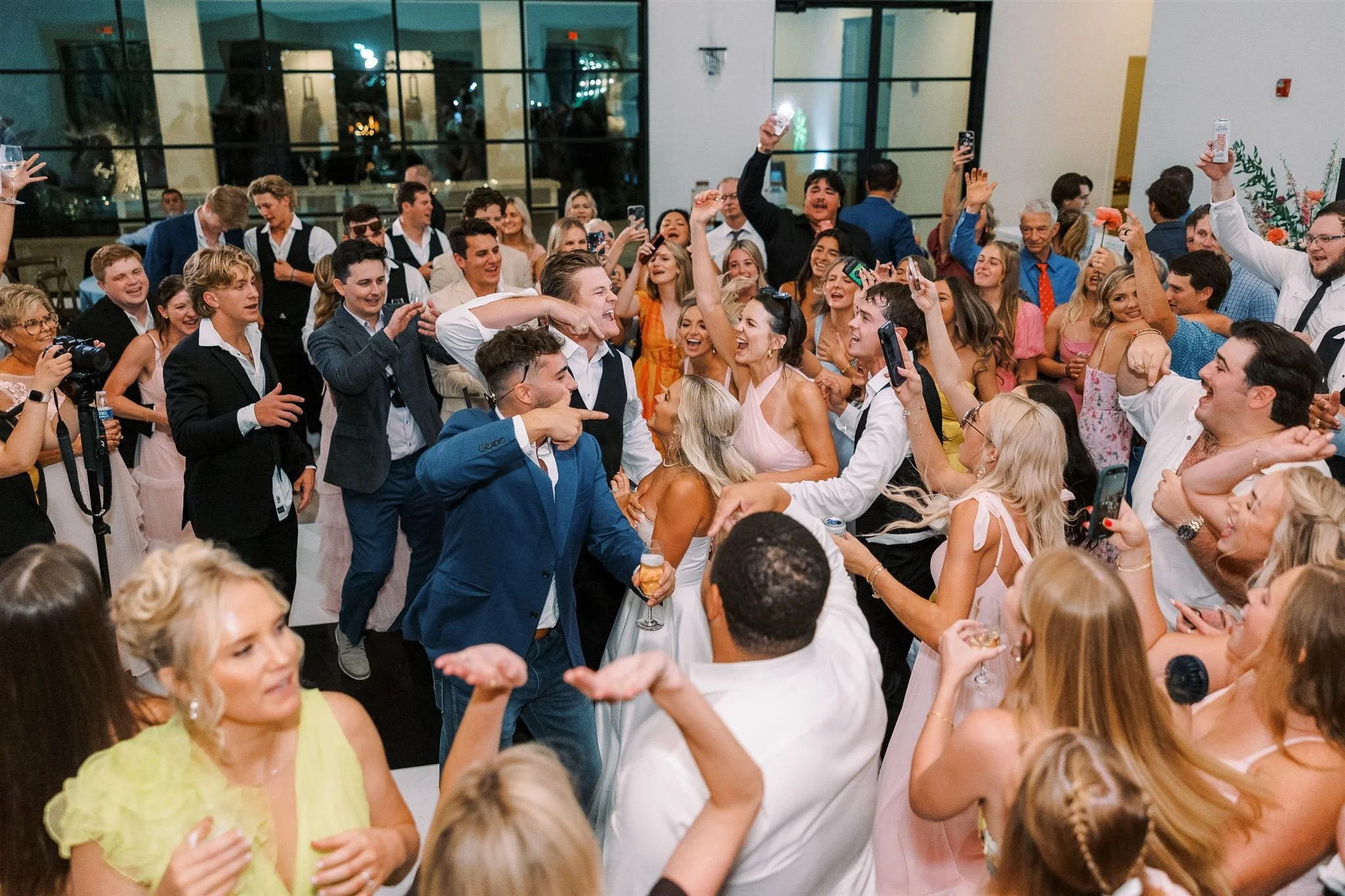 Wedding guests celebrating on the dance floor