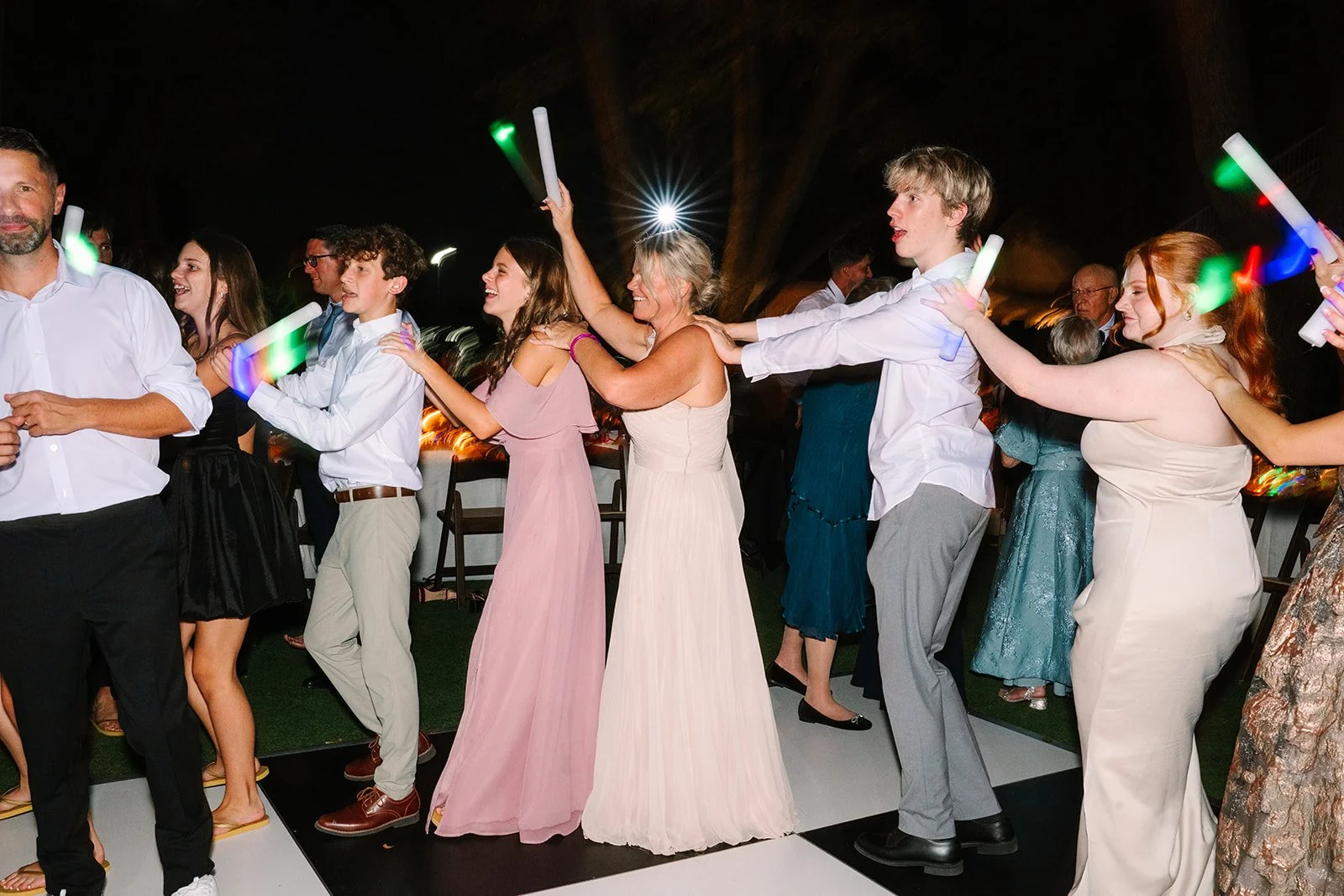 Wedding guests celebrating on the dance floor