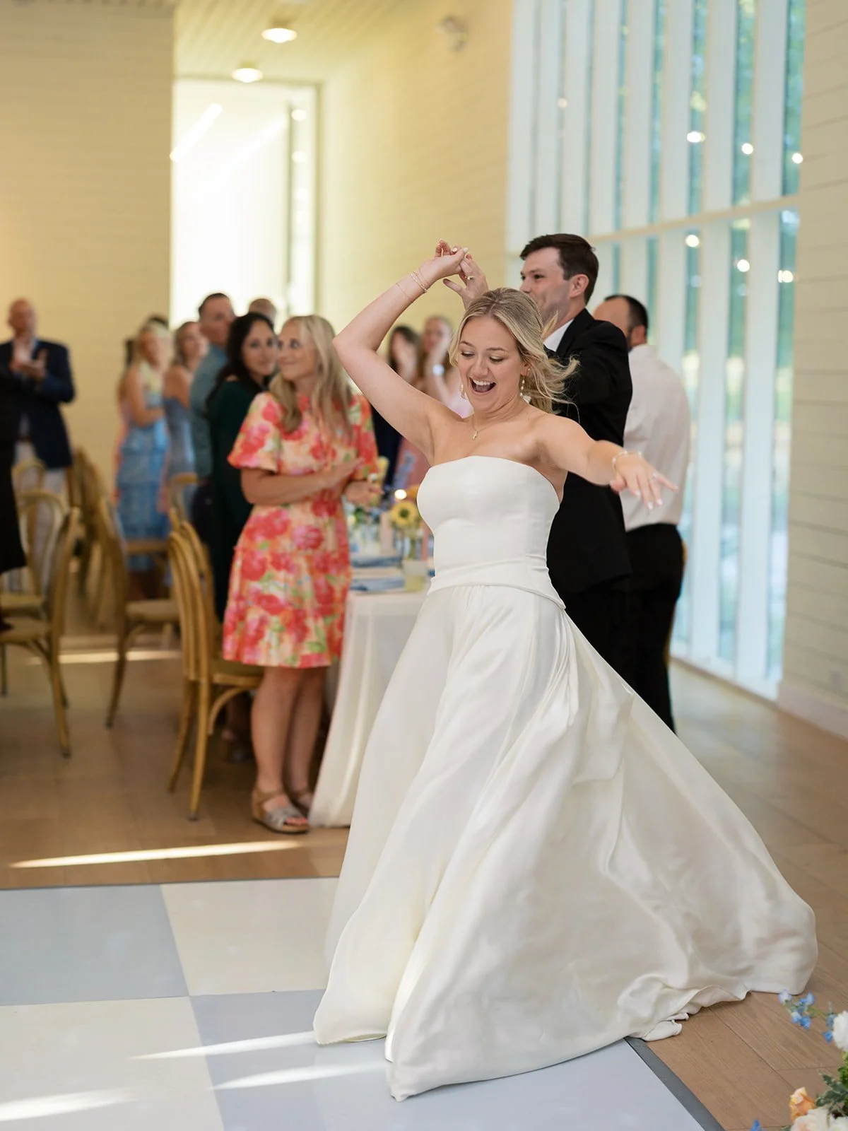 Wedding guests celebrating on the dance floor