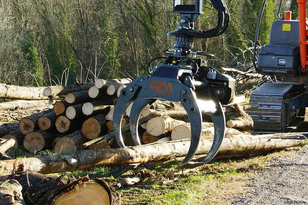 QM PZ Series Log Grab Attachment Operating In The Field