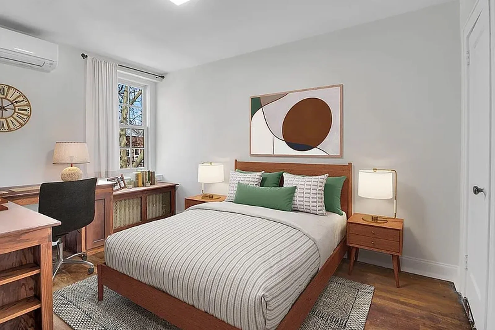 Bedroom with custom built-in desk and woodwork