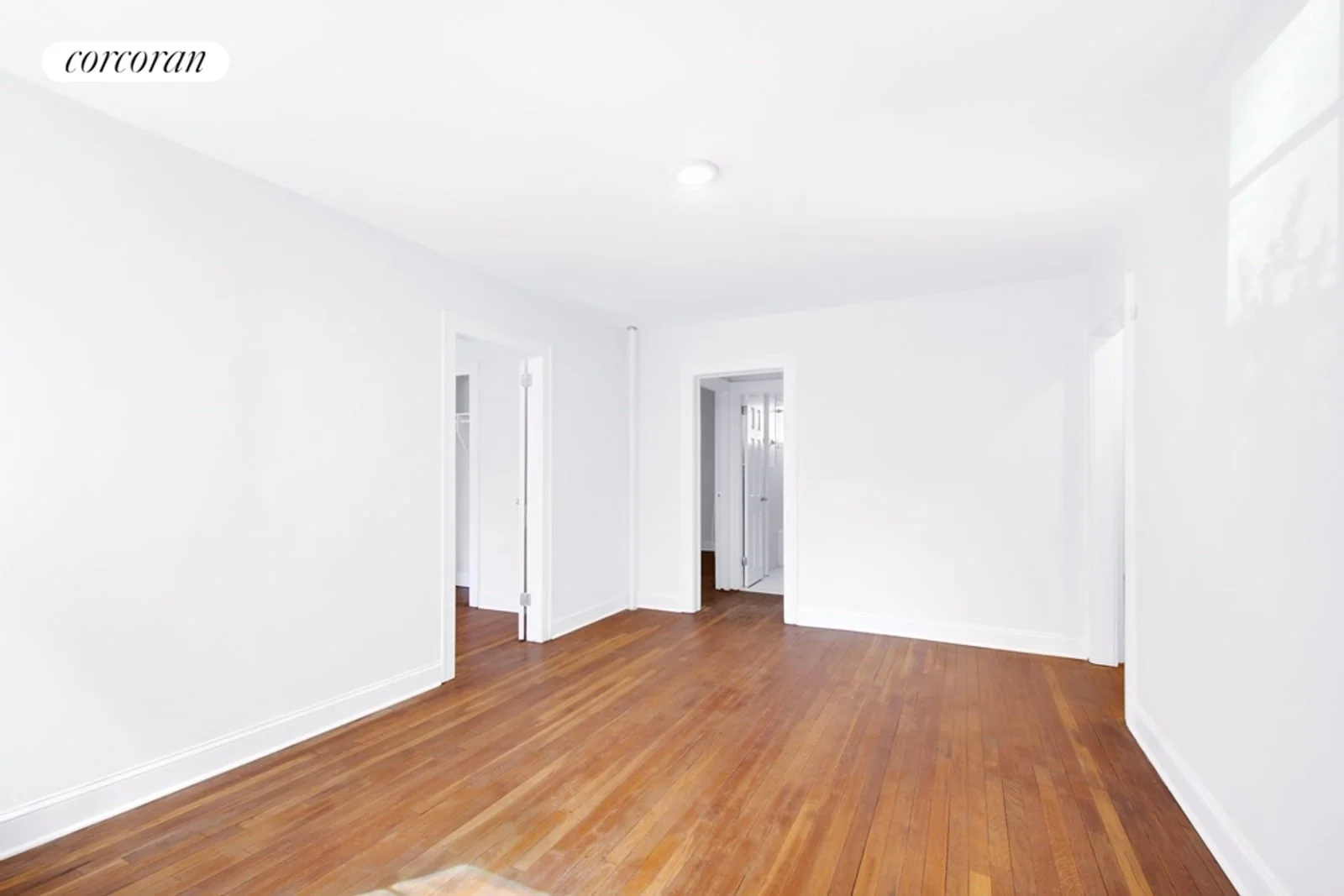 Bright living room with original hardwood floors