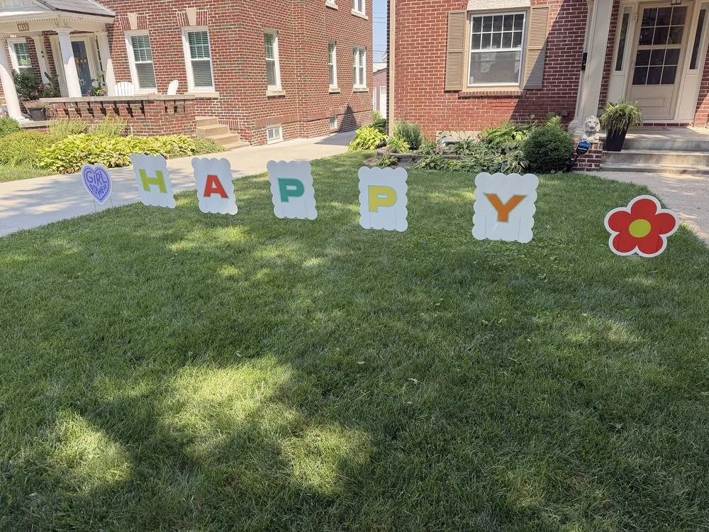 Birthday yard sign letters installed on an Omaha front lawn