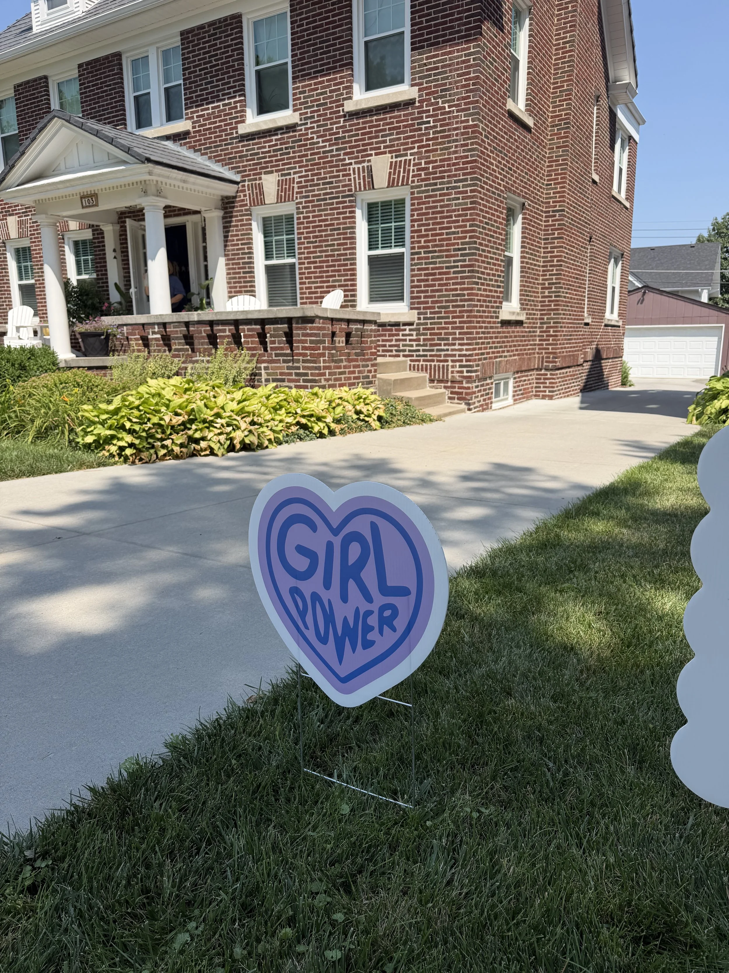 Happy Birthday yard sign with heart accent, installed in Westside, Omaha