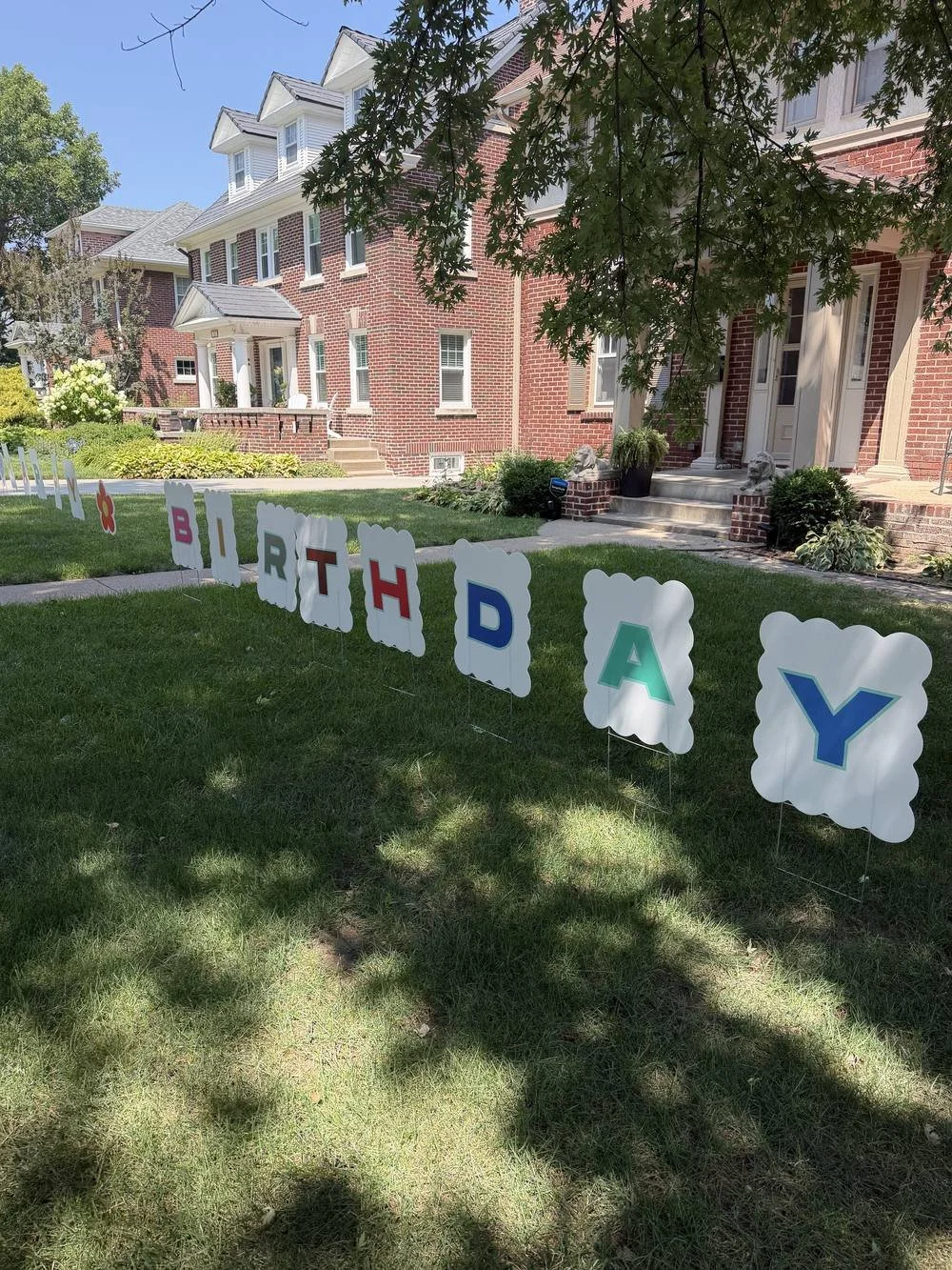 Happy Birthday yard sign rental delivered to a front lawn in Omaha, NE
