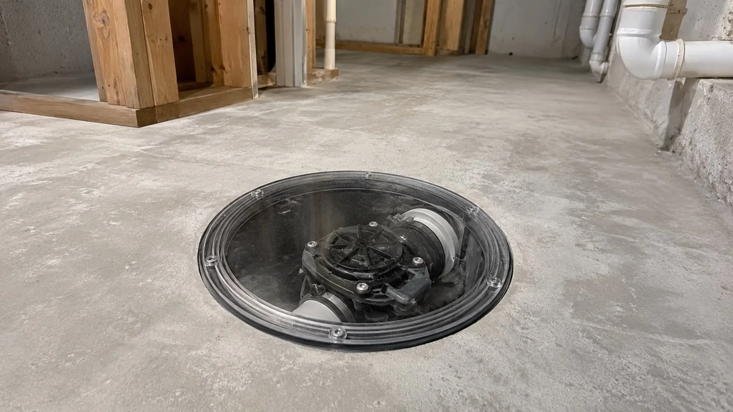Backwater valve installed in a North York basement floor by MBM Plumbing