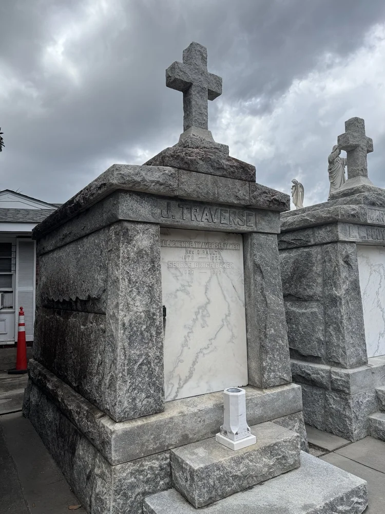 Stone crosses above cemetery monuments.