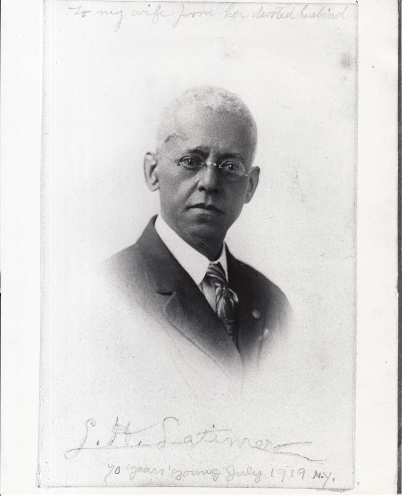 Lewis H. Latimer in a suit, in a portrait inscribed to his wife, July 1919.