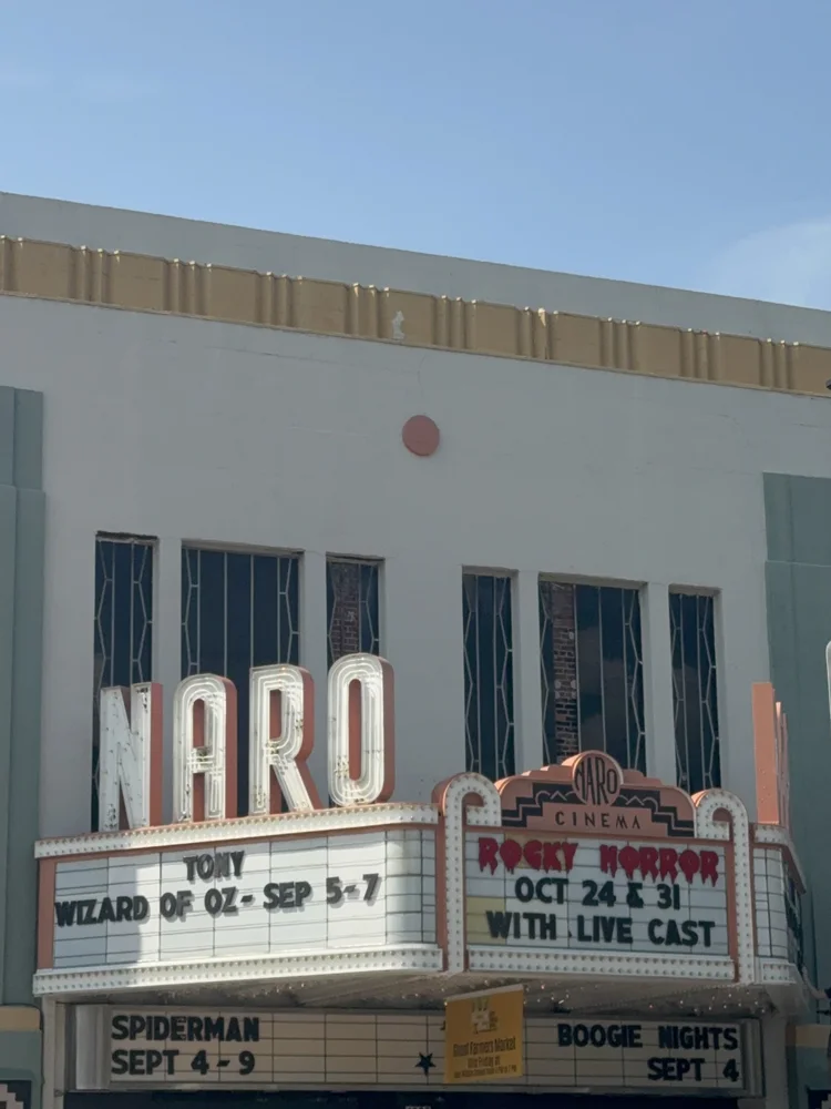 A vintage theater facade and marquee.