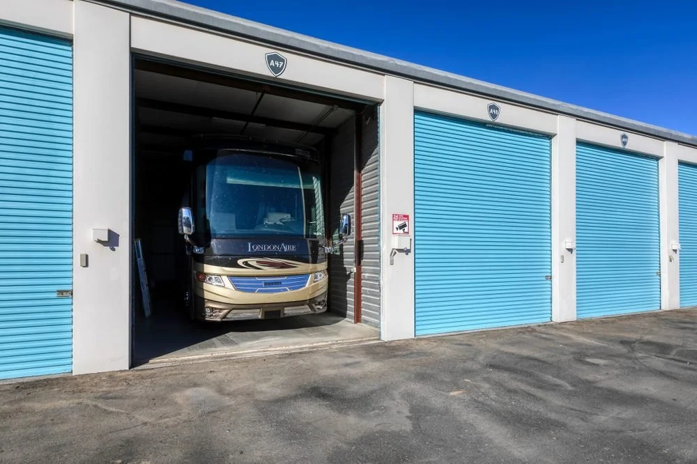 Enclosed RV storage unit with roll-up door open at Carefree Covered RV Storage in Chandler, AZ