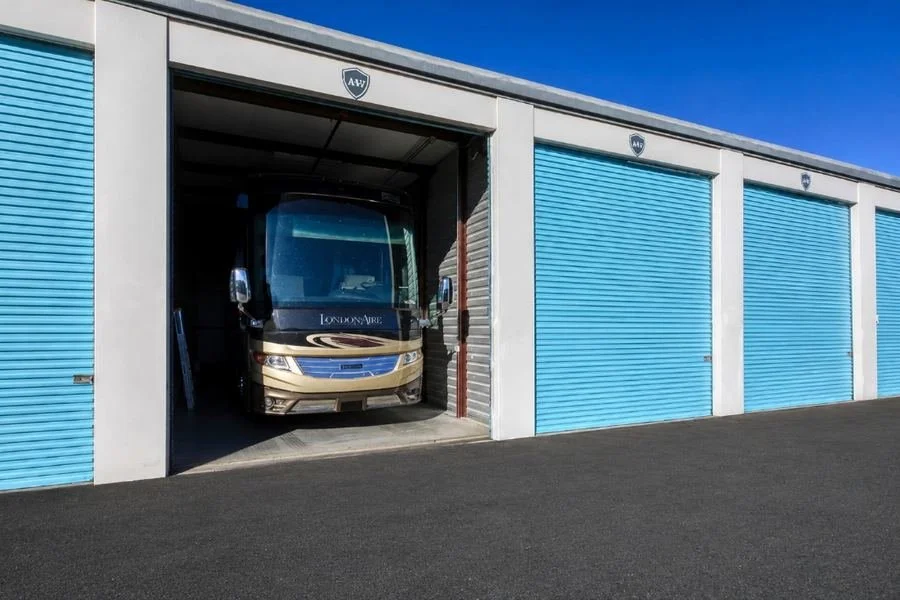 Class A motorhome pulling into an enclosed RV storage unit at Carefree Covered RV Storage in Wylie, TX