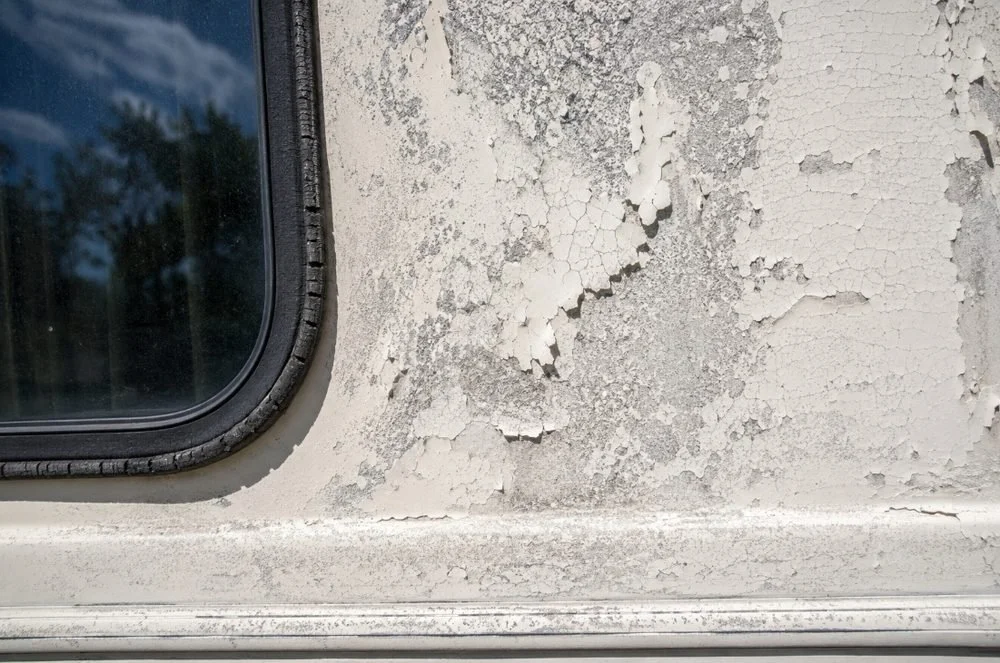 Close-up of oxidized and chalky RV paint caused by prolonged UV exposure in Arizona sun