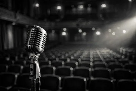 A vintage microphone before an empty theatre