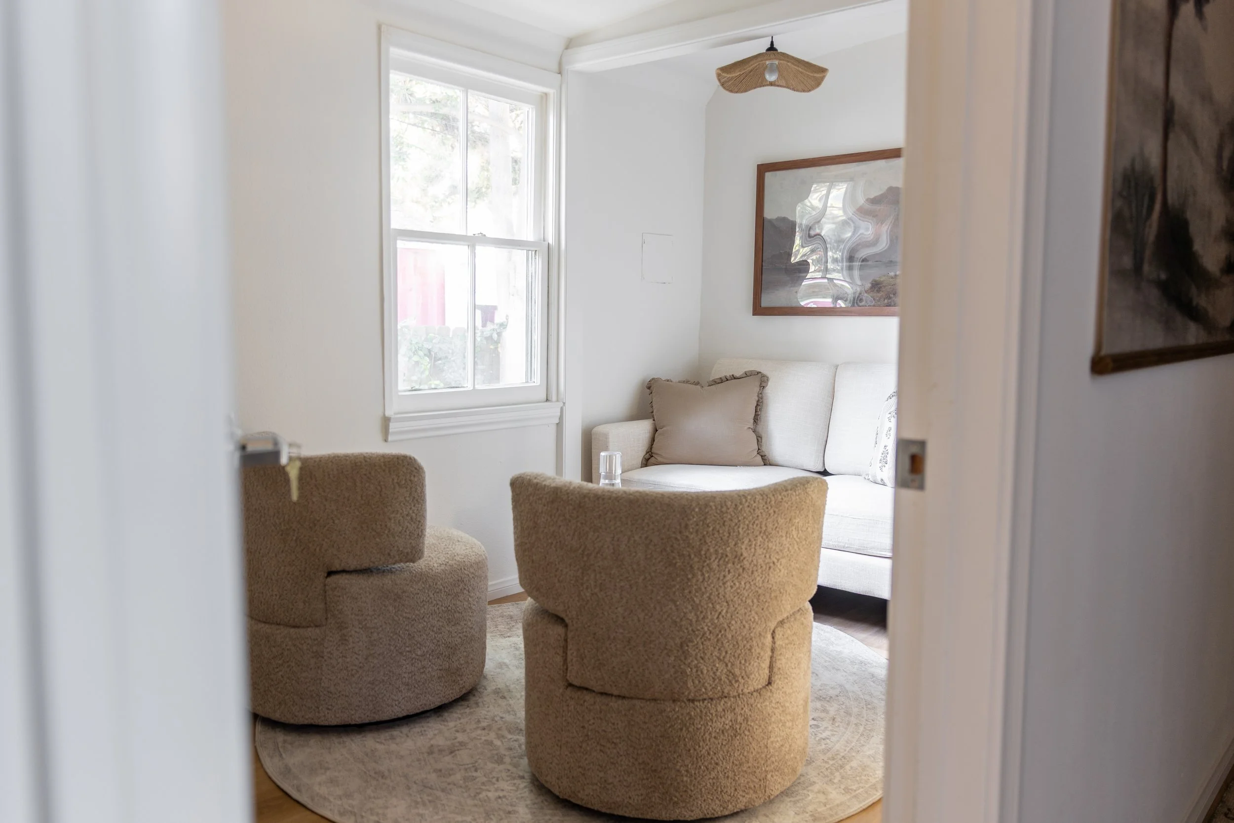 A calm light-filled therapy office space