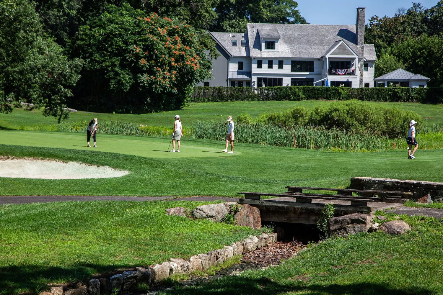The Great Lawn at The Inn at Longshore running down toward the water